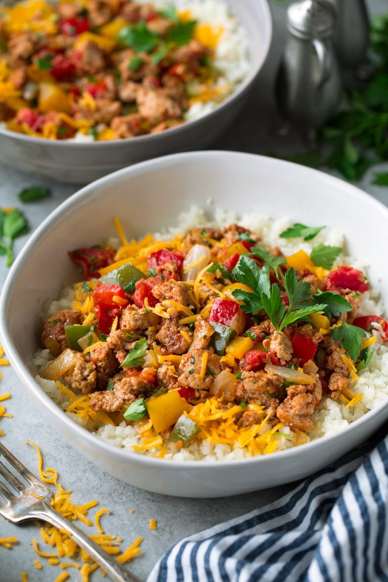 Bowls are layered with store-bought cauliflower rice (white or brown rice may be substituted), cheddar, and a seasoned ground turkey and bell pepper mixture. Just think unstuffed bell peppers - meaning all the flavor without all the time and hassle! 