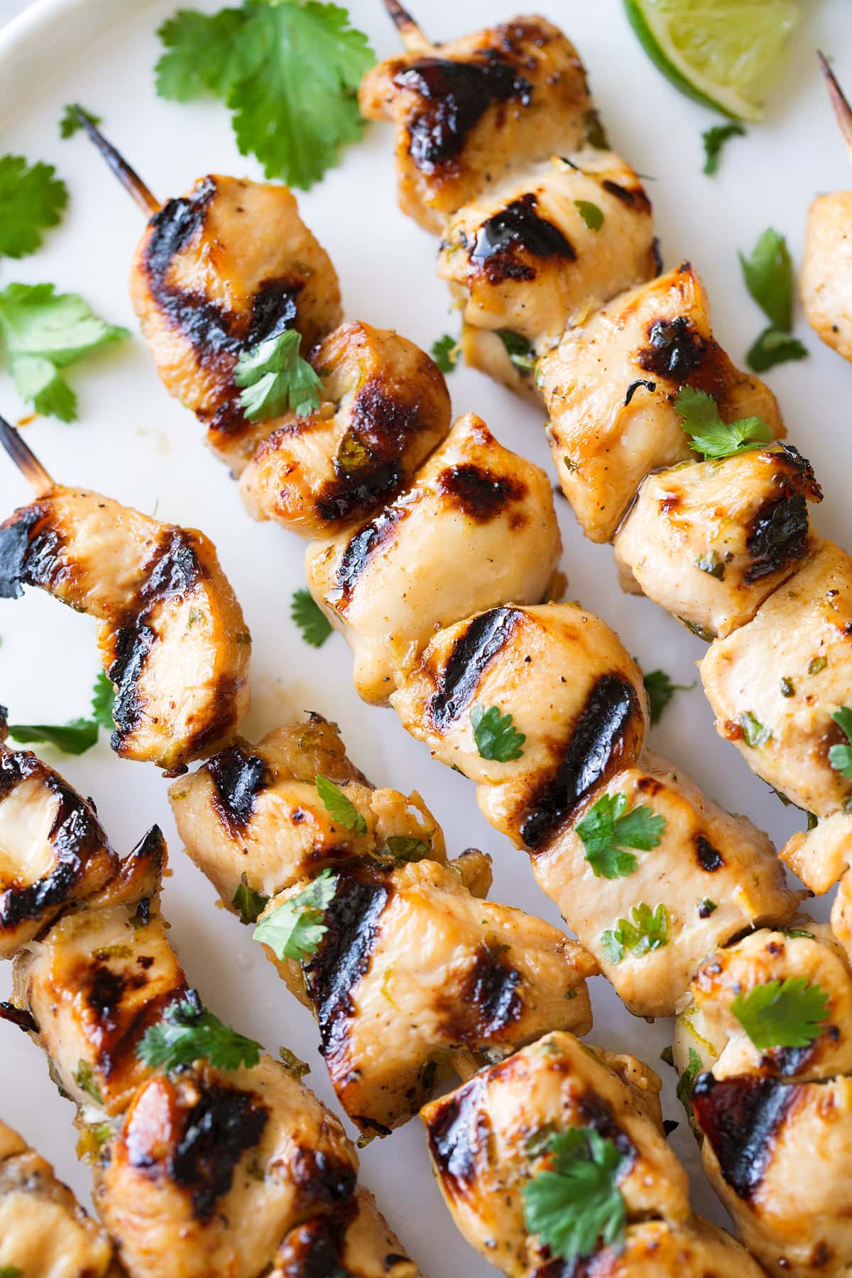 honey lime chicken skewers garnished with fresh cilantro