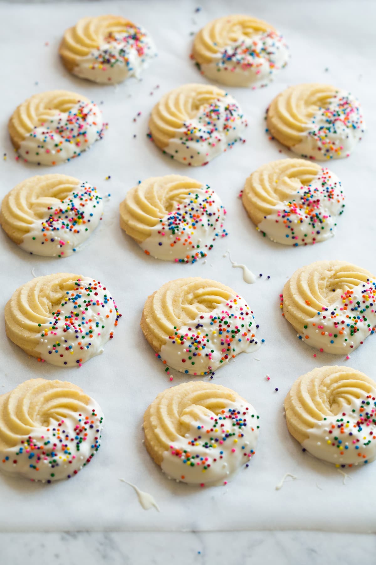 Butter cookies on parchment paper.