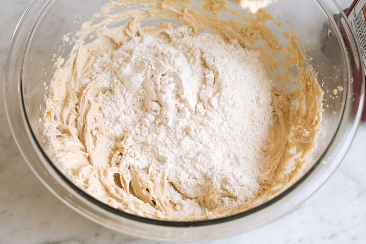 Adding flour to mixing bowl for edible cookie dough