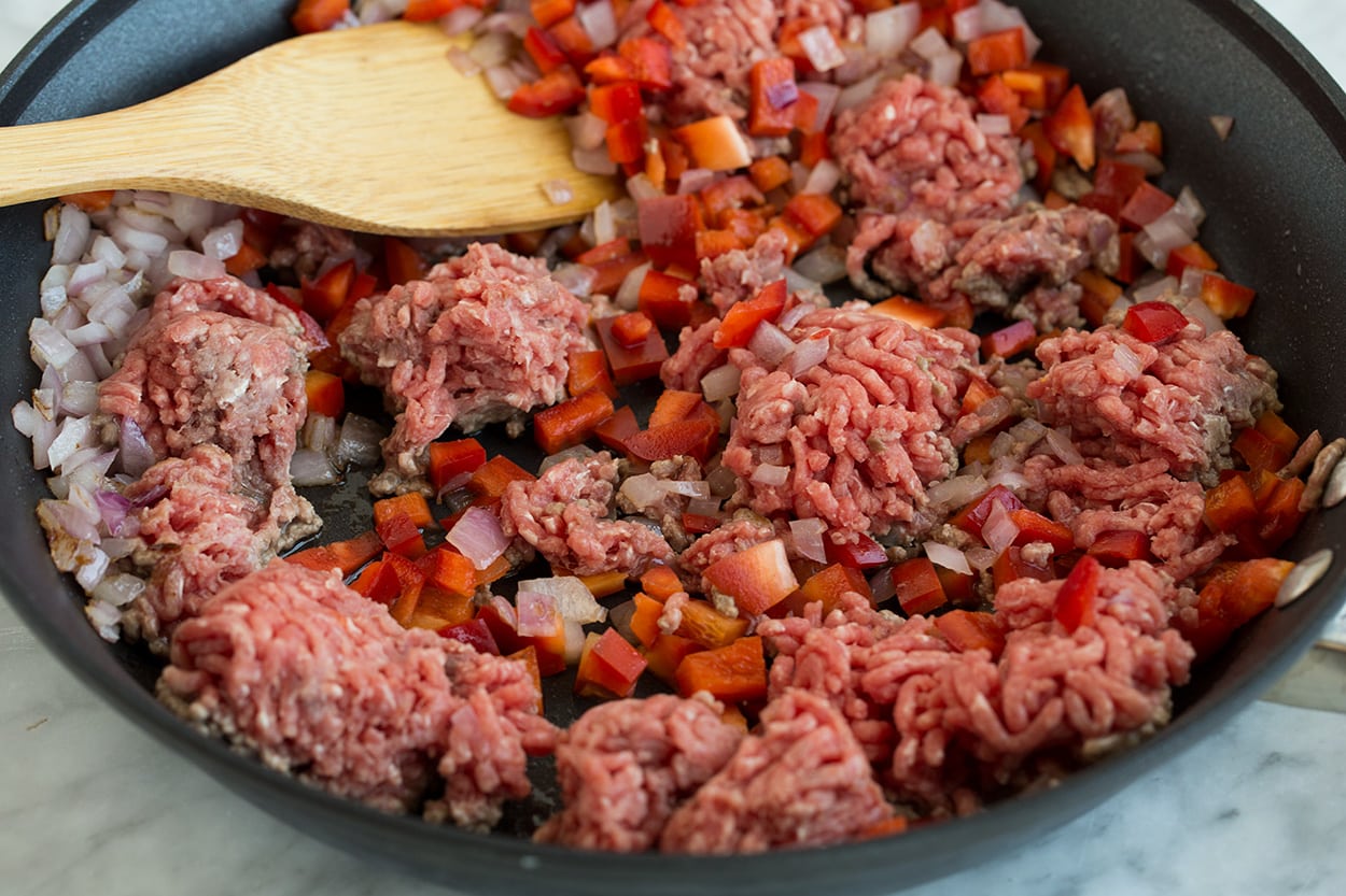 Browning ground beef and onions in skillet to make Chimichurri Beef and Rice