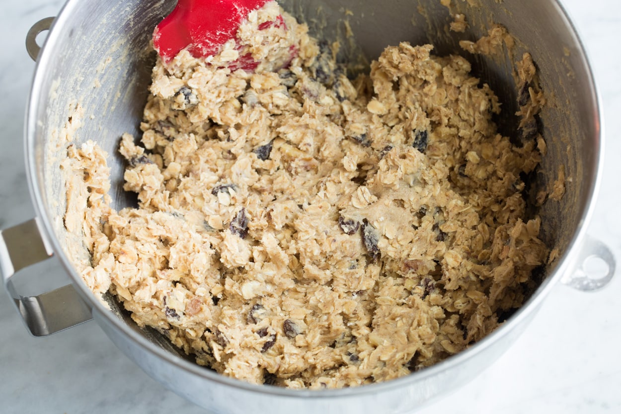 Finished oatmeal cookie dough in stand mixer bowl.