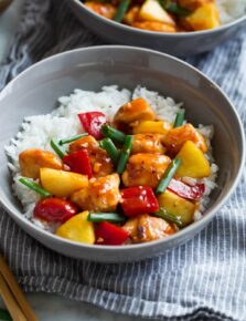 Sweet and Sour Chicken in serving bowl with white rice.