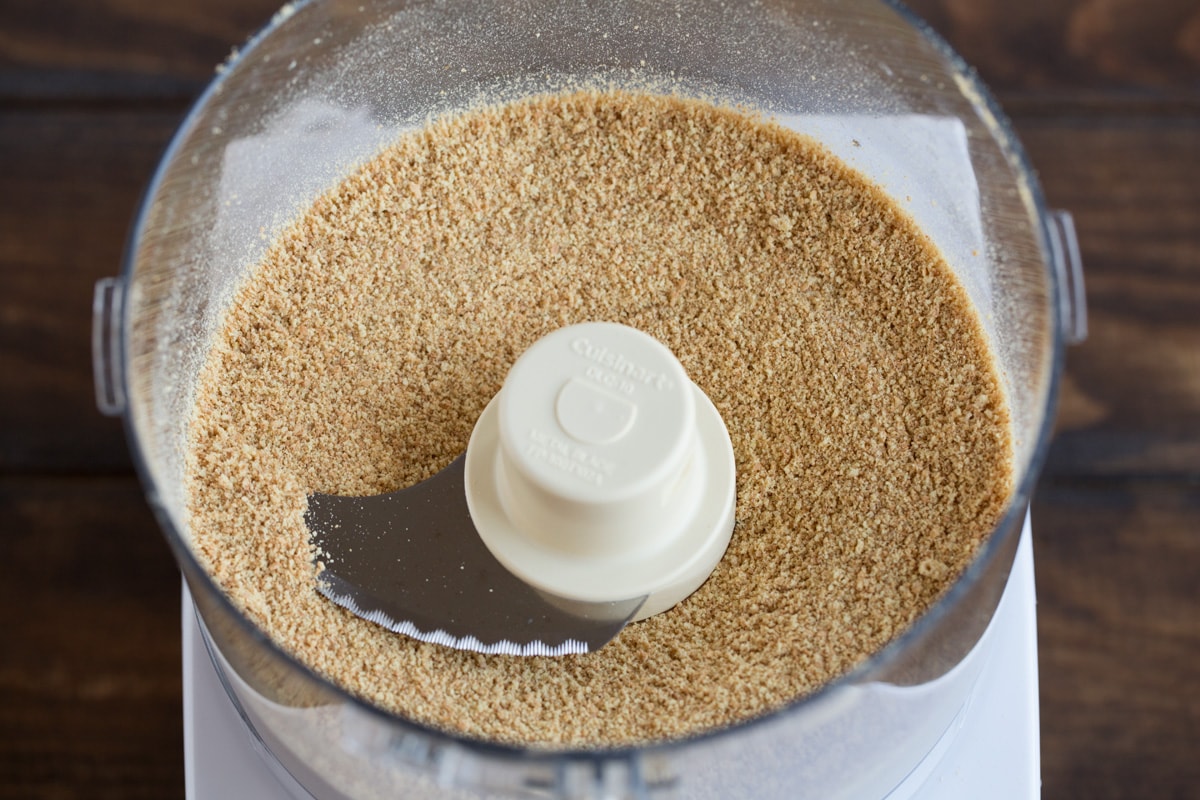 Making graham cracker crumbs in a food processor for key lime pie crust.