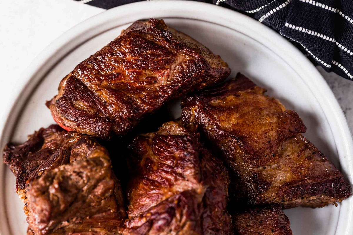 Golden chuck roast beef pieces to make barbecue meat.