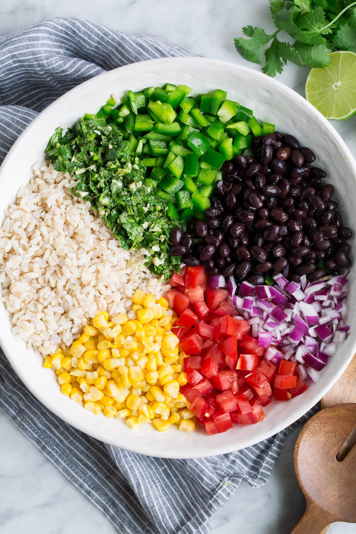Fiesta Rice Ingredients in a salad bowl before tossing together.