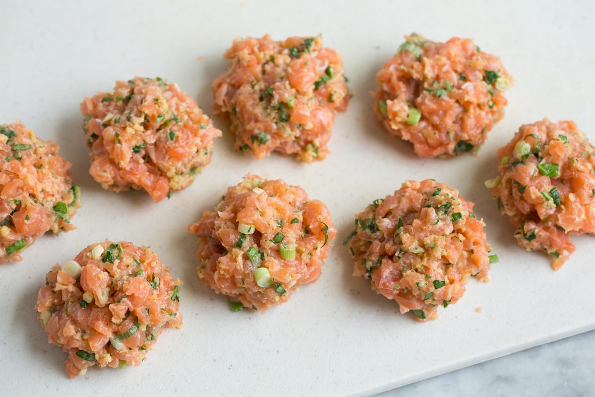 Salmon patty mixture divided into eight equal portions.