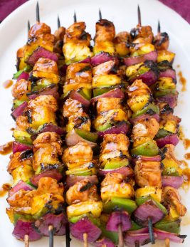 Grilled Hawaiian Chicken Kebabs on a white platter.