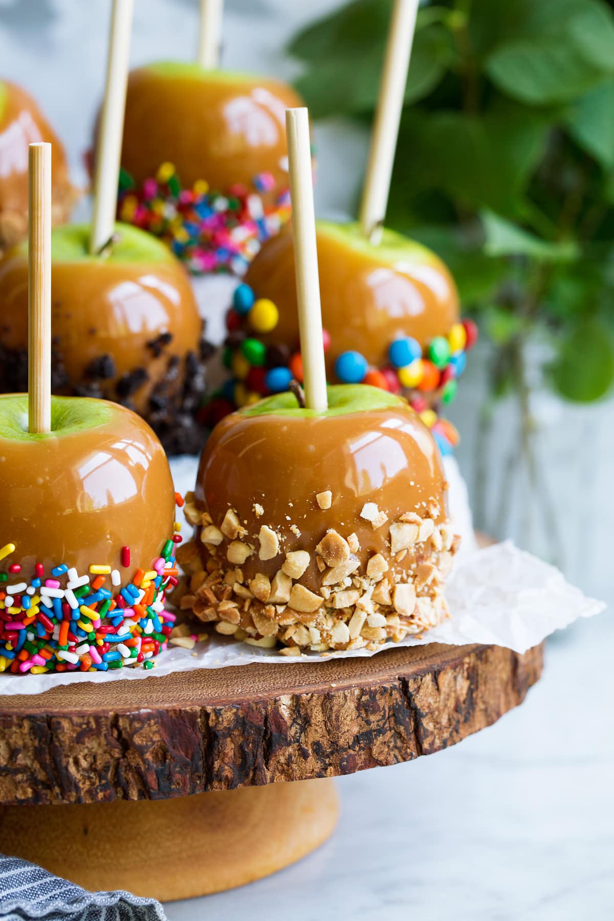 Close up image of stand full of caramel apples.