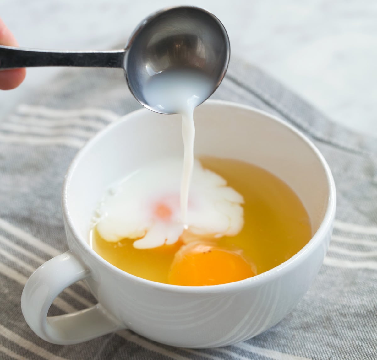 Adding Milk to eggs in cup