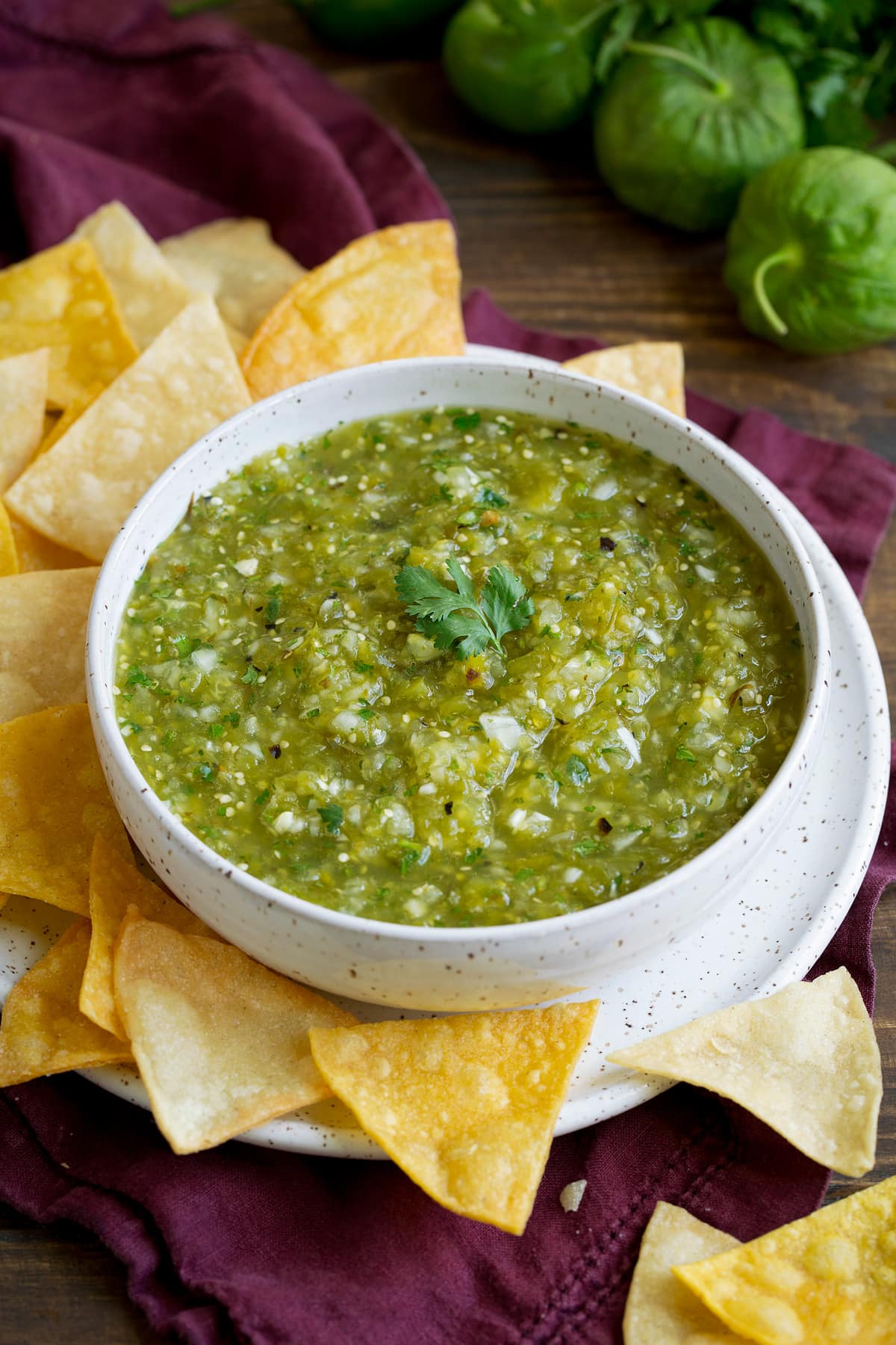 Salsa Verde in a bowl with a side of tortilla chips.