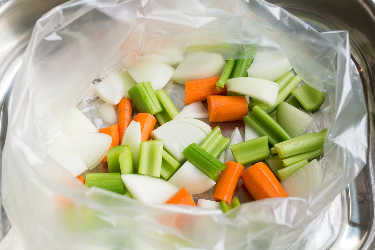 Chopped onion, celery and carrots in a roasting bag.