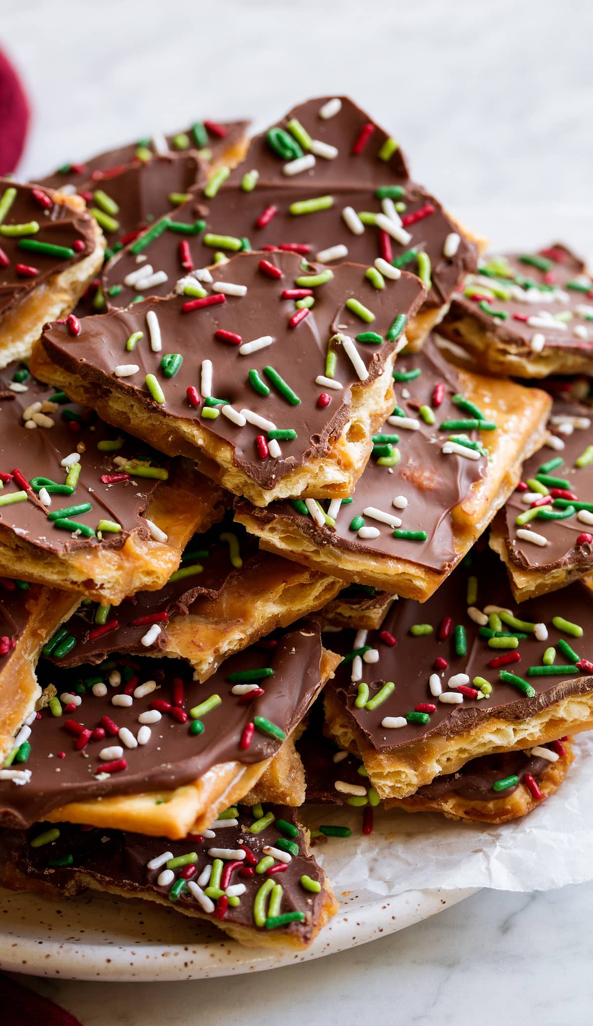 Close up image of Christmas Crack covered with chocolate and sprinkles.