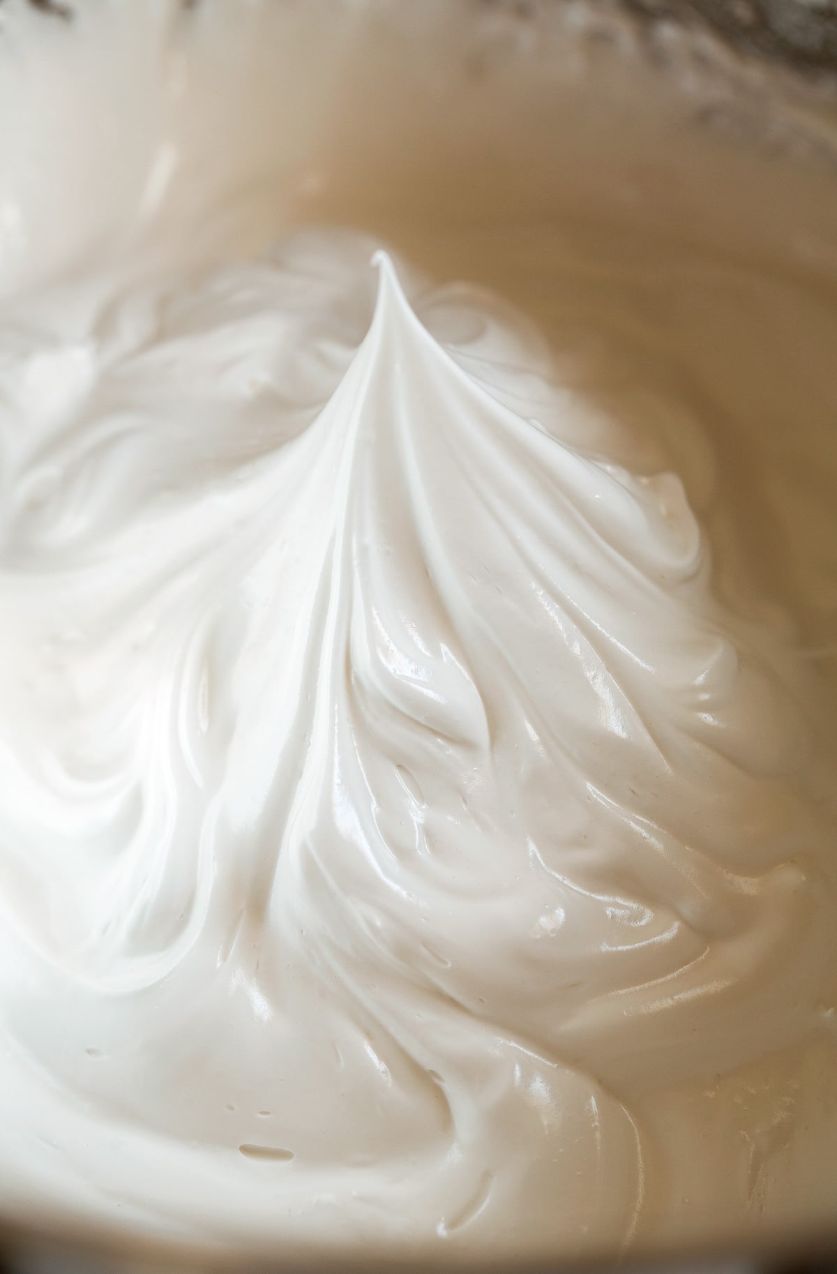 Image showing what a stiff peak is in meringue.