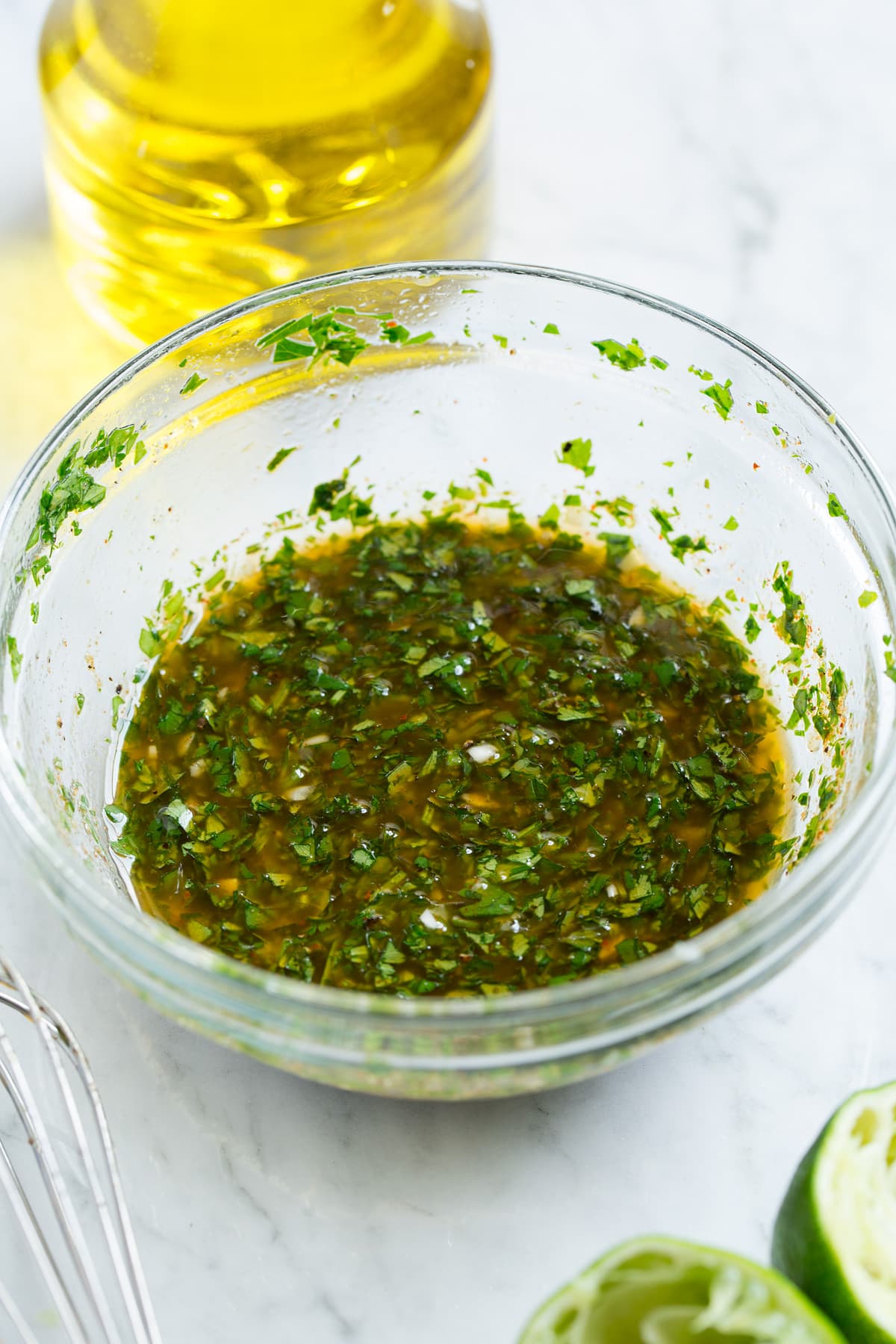 Cilantro Lime Vinaigrette shown in a glass mixing bowl after blending together. This is the dressing used for black bean salad.