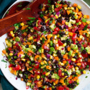 Black bean and corn salad with bell pepper, avocado, tomato and cilantro lime dressing.