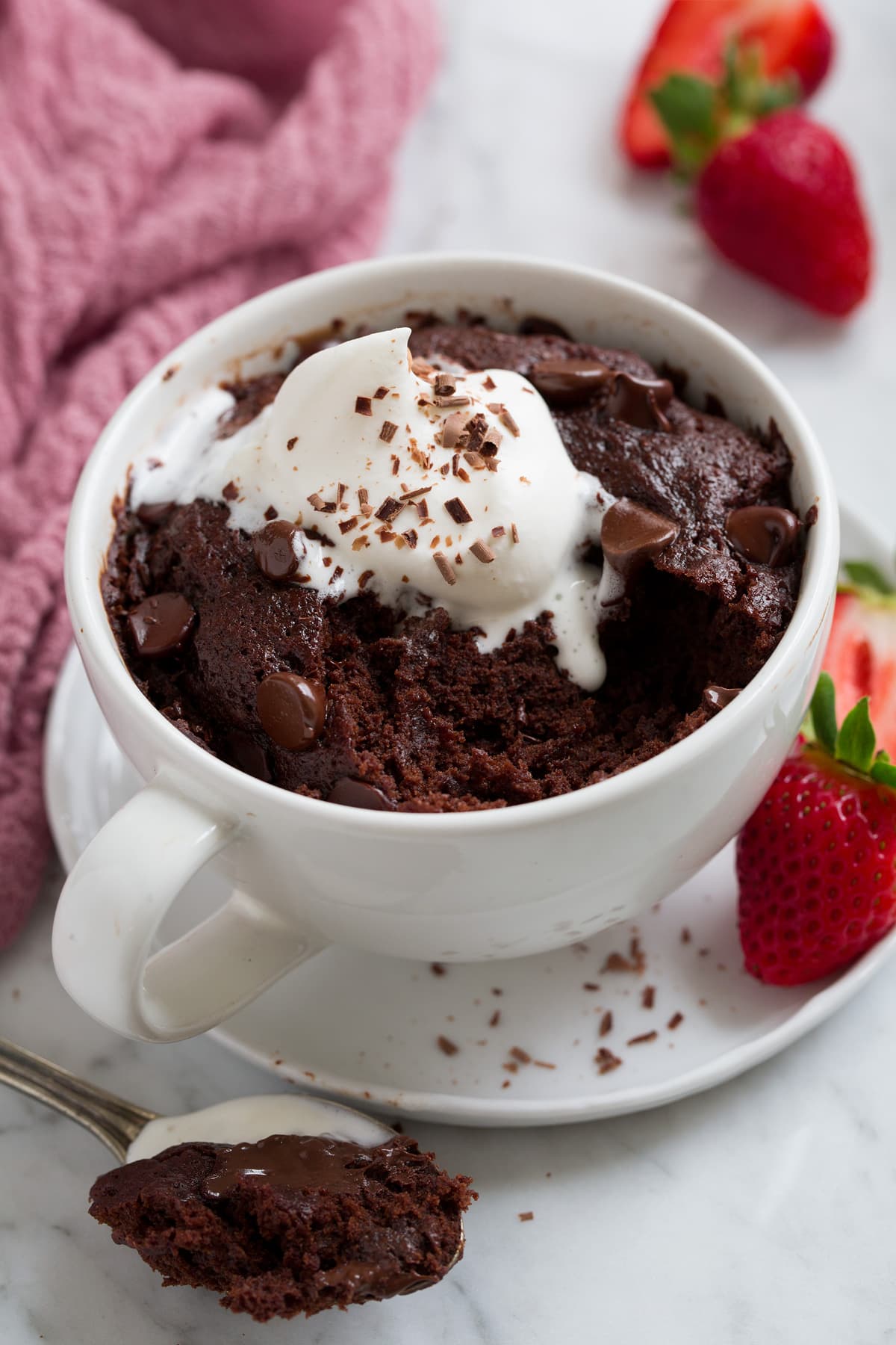 Chocolate Mug Cake with a scoop removed to show filling.