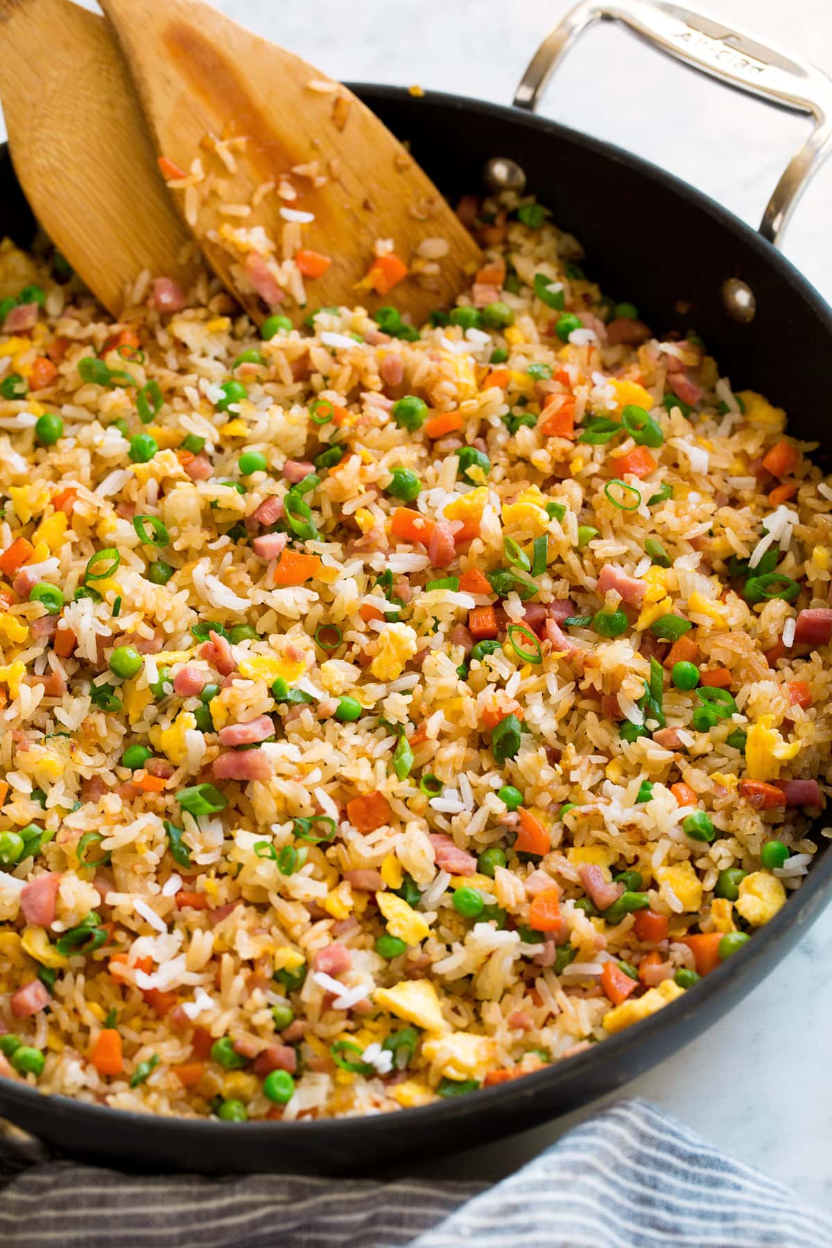 Close up side view of fried rice in a skillet.
