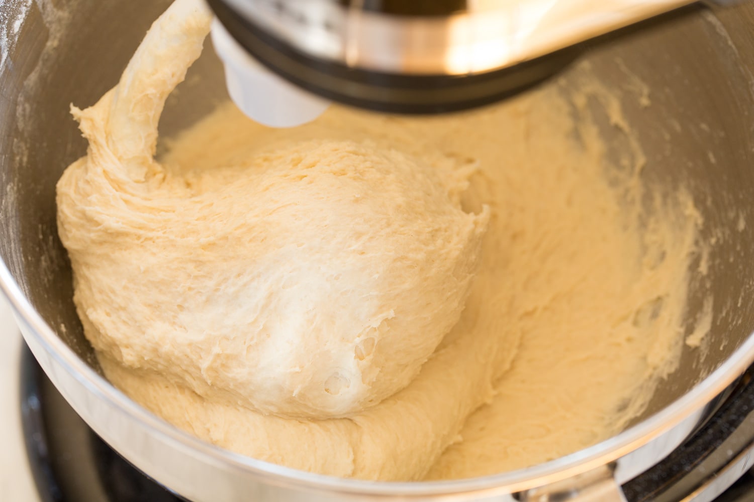 Kneaded roll dough in stand mixer.