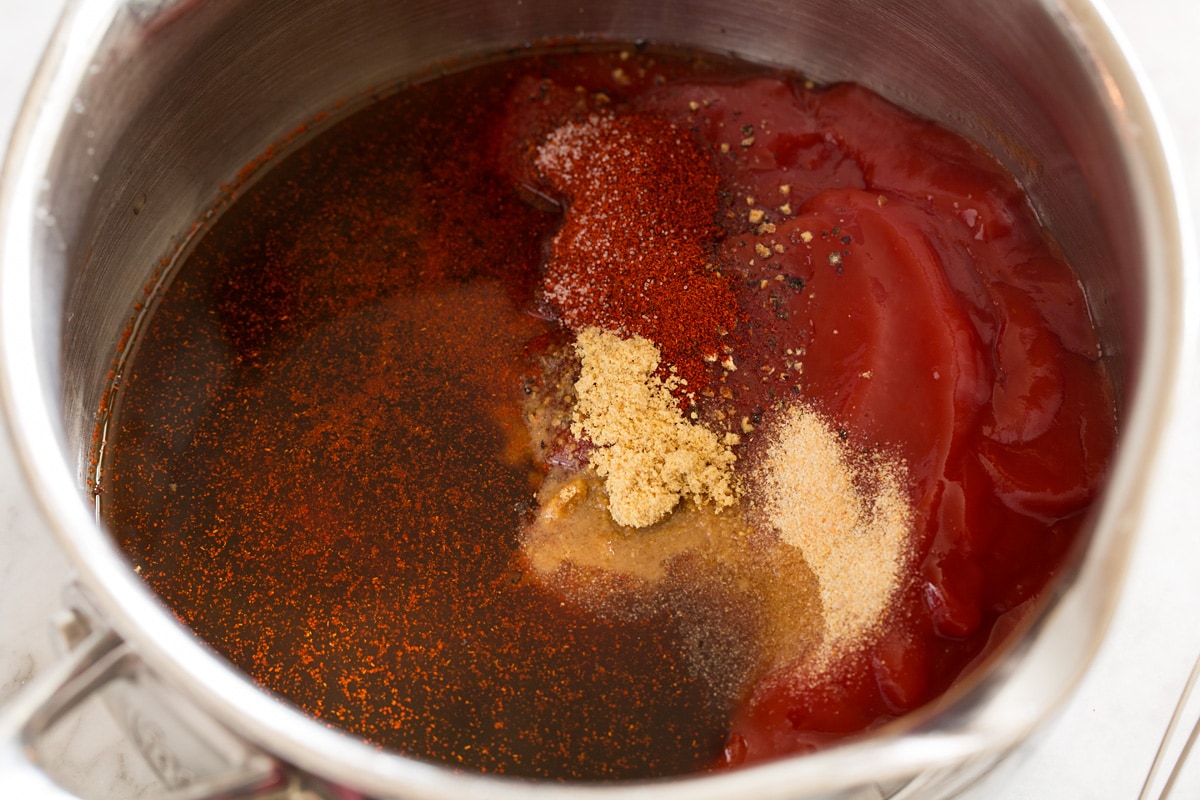 BBQ sauce ingredients in a saucepan before mixing.