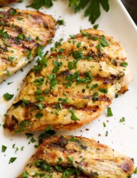 Close up image of grilled creamy garlic dijon chicken.