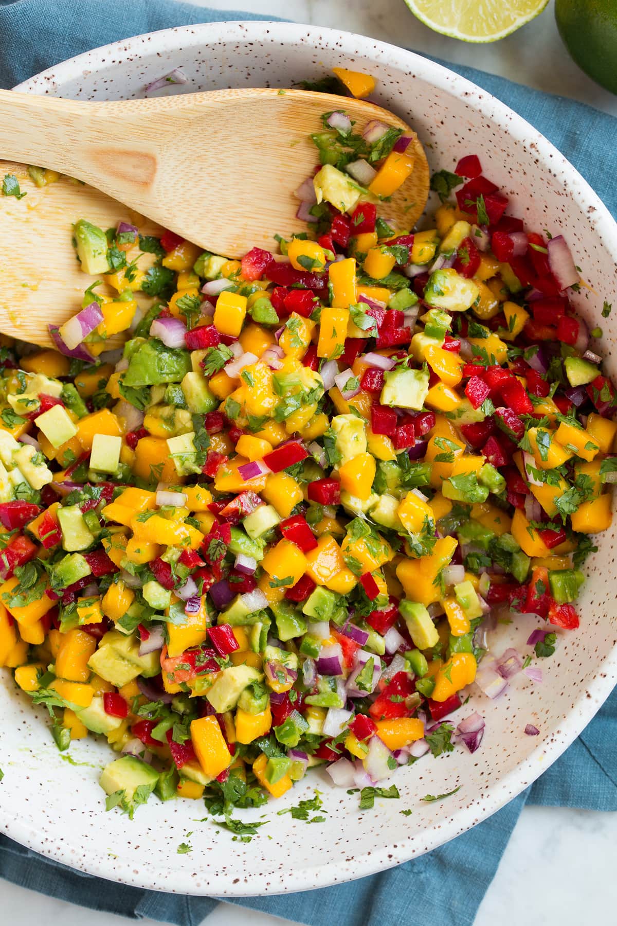 Close up image of mango salsa shown after tossing ingredients.