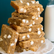 Stack of blondies with white chocolate chips.