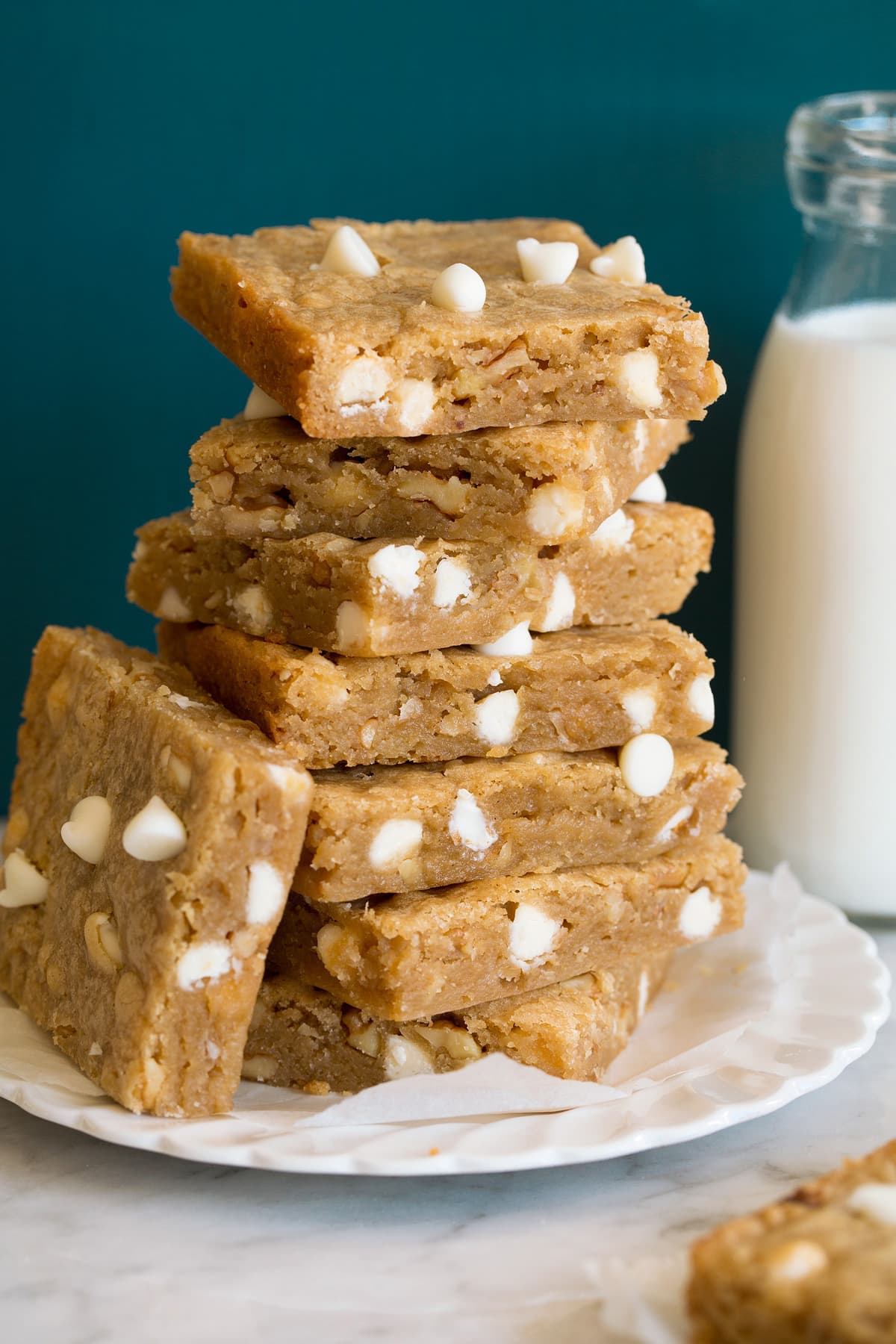 Stack of blondies with white chocolate chips.
