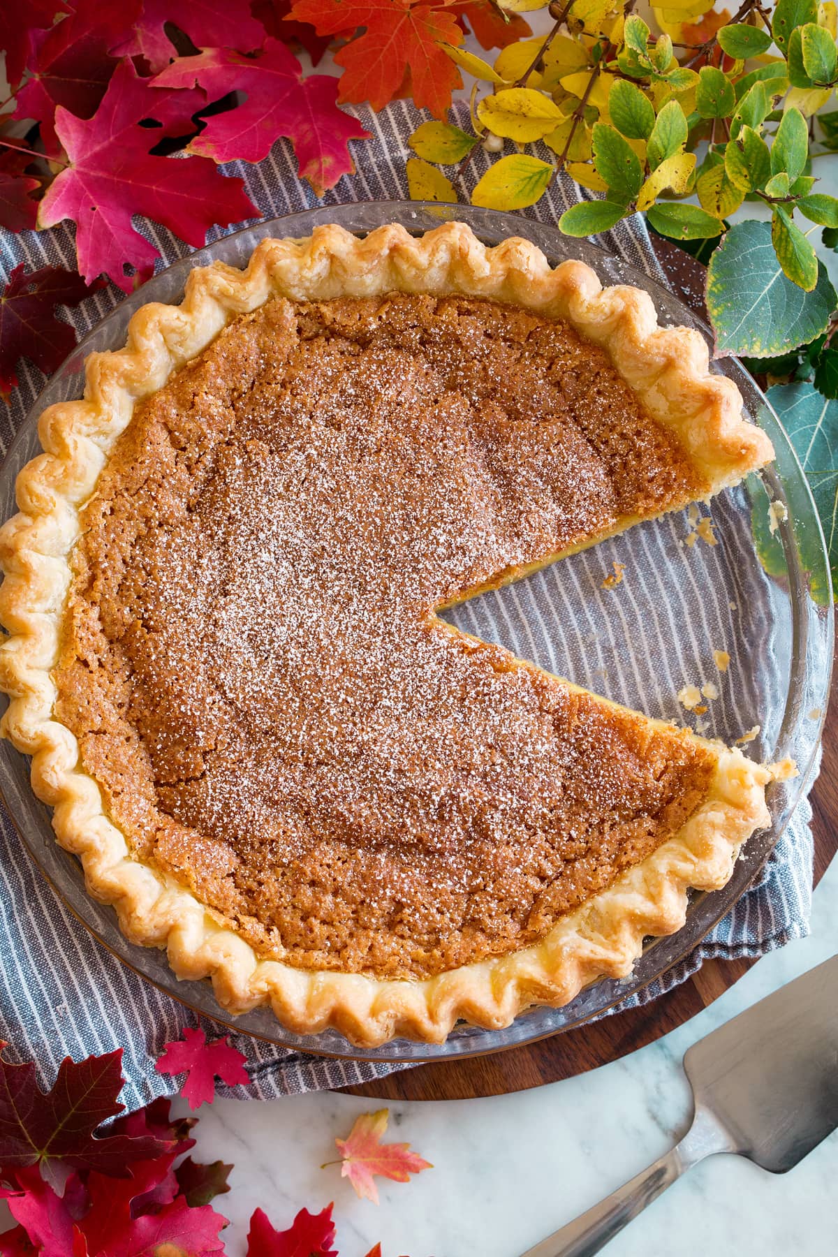 Overhead image of chess pie with one slice cut and removed.