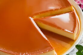 Image of flan with a slice cut.