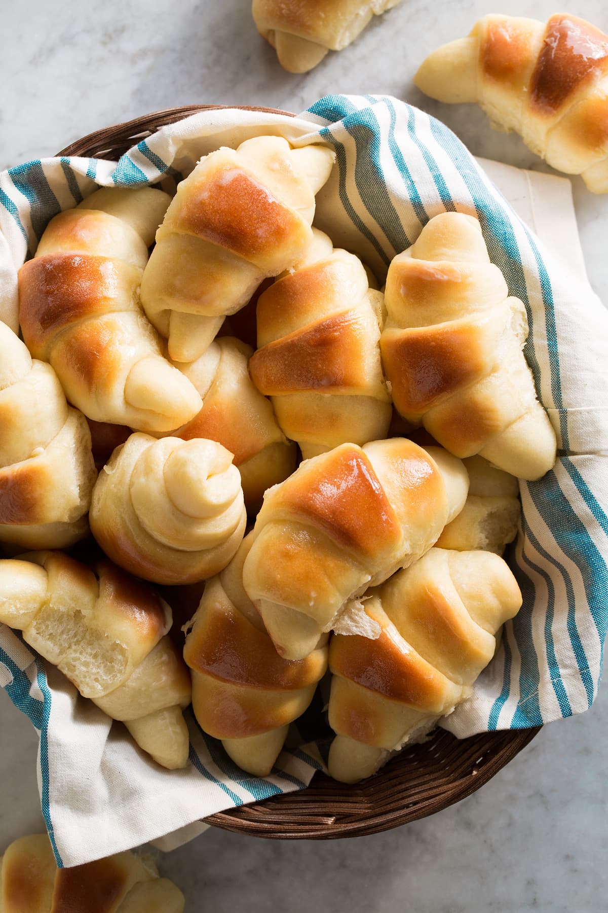 Overhead image of dinner rolls in a wicker serving basket.