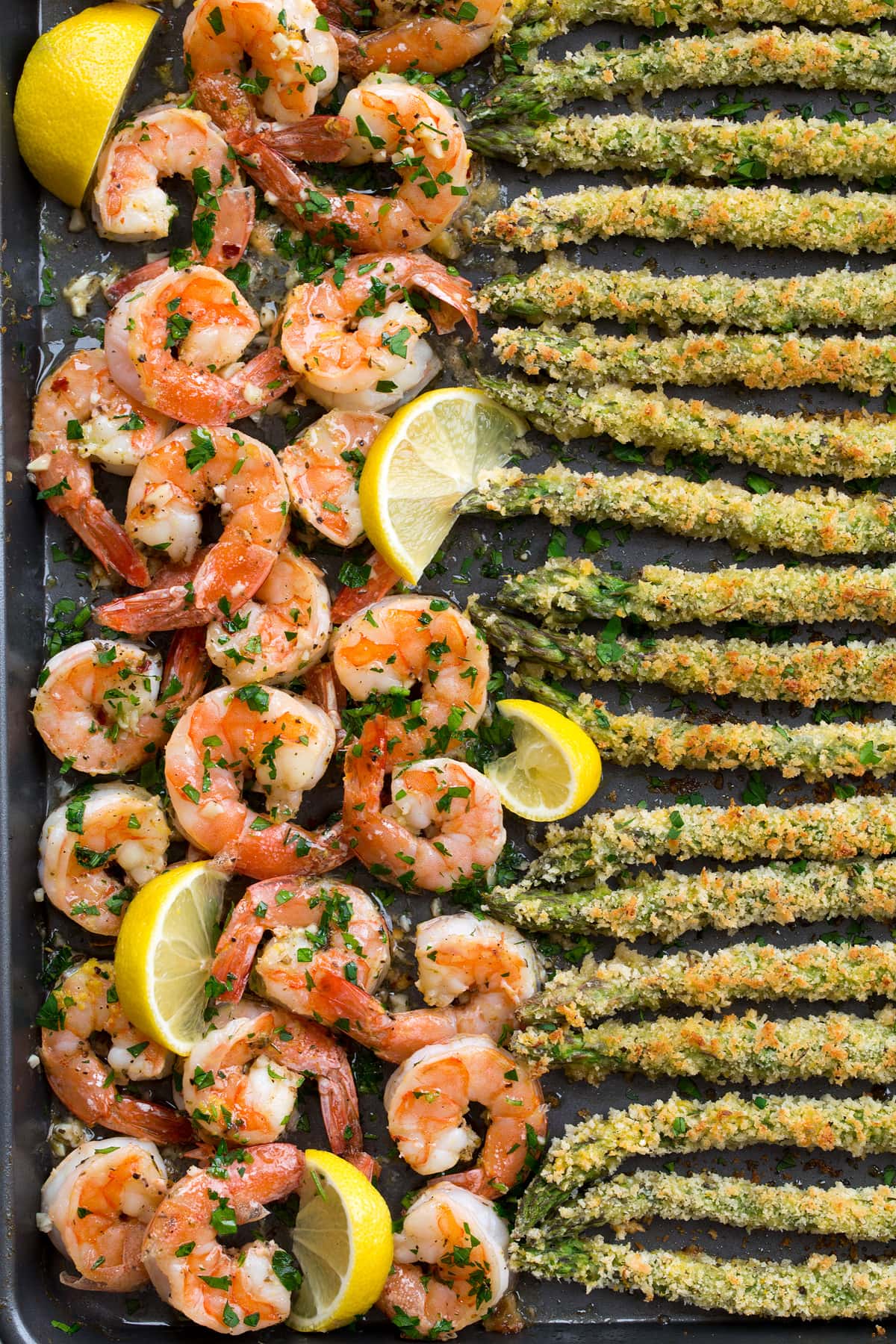Close up photo of shrimp and crusted asparagus.