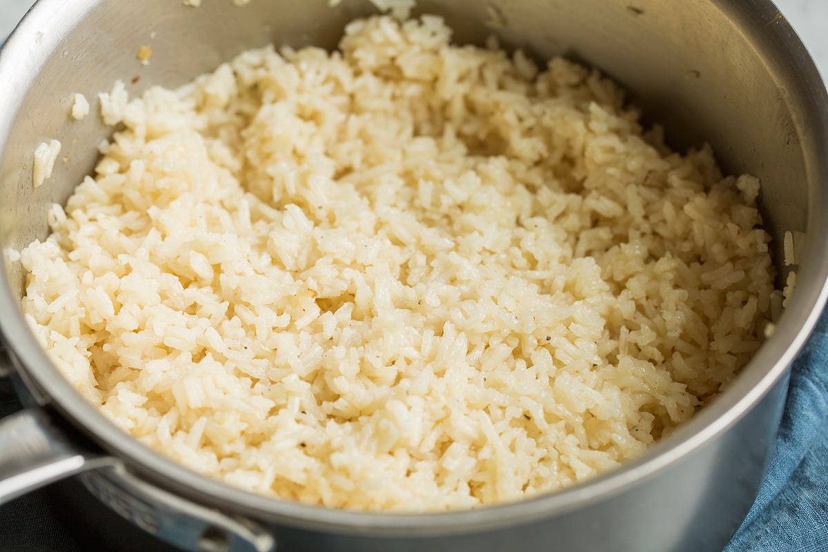 Garlic butter rice shown in a skillet after cooking.