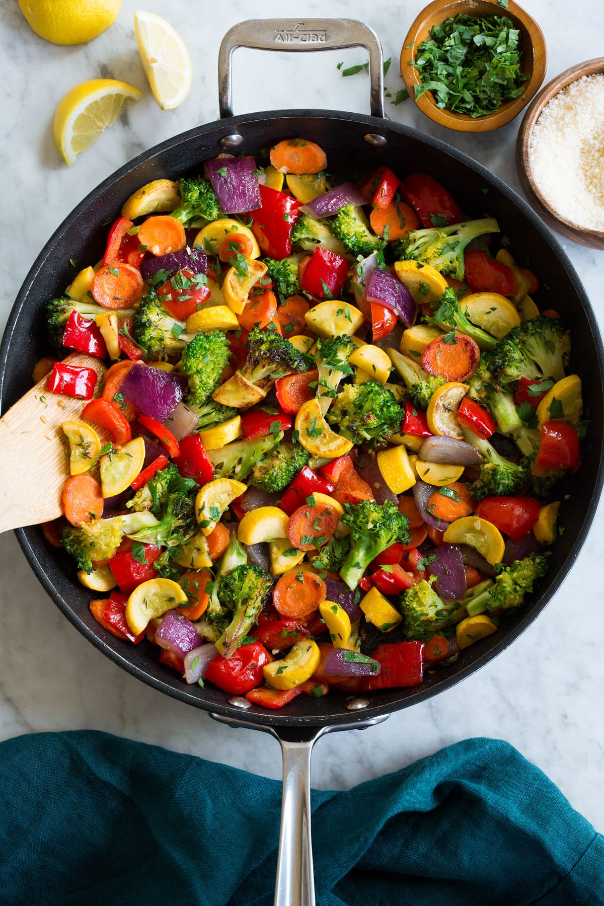 Photo: Sautéed Vegetables shown from above in a black skillet sitting on a marble tabletop.