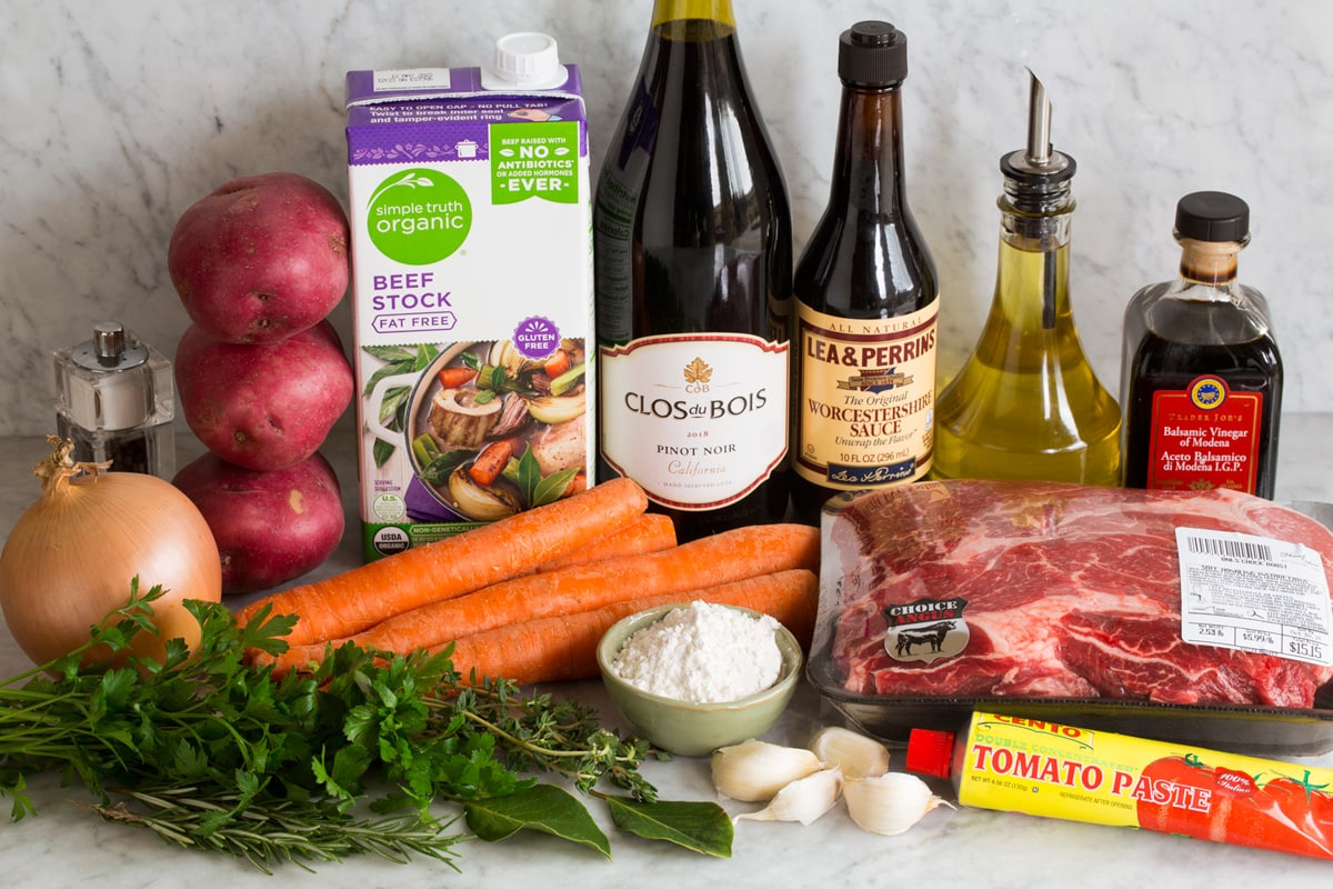 Image of ingredients that are used to make beef stew shown on a counter.