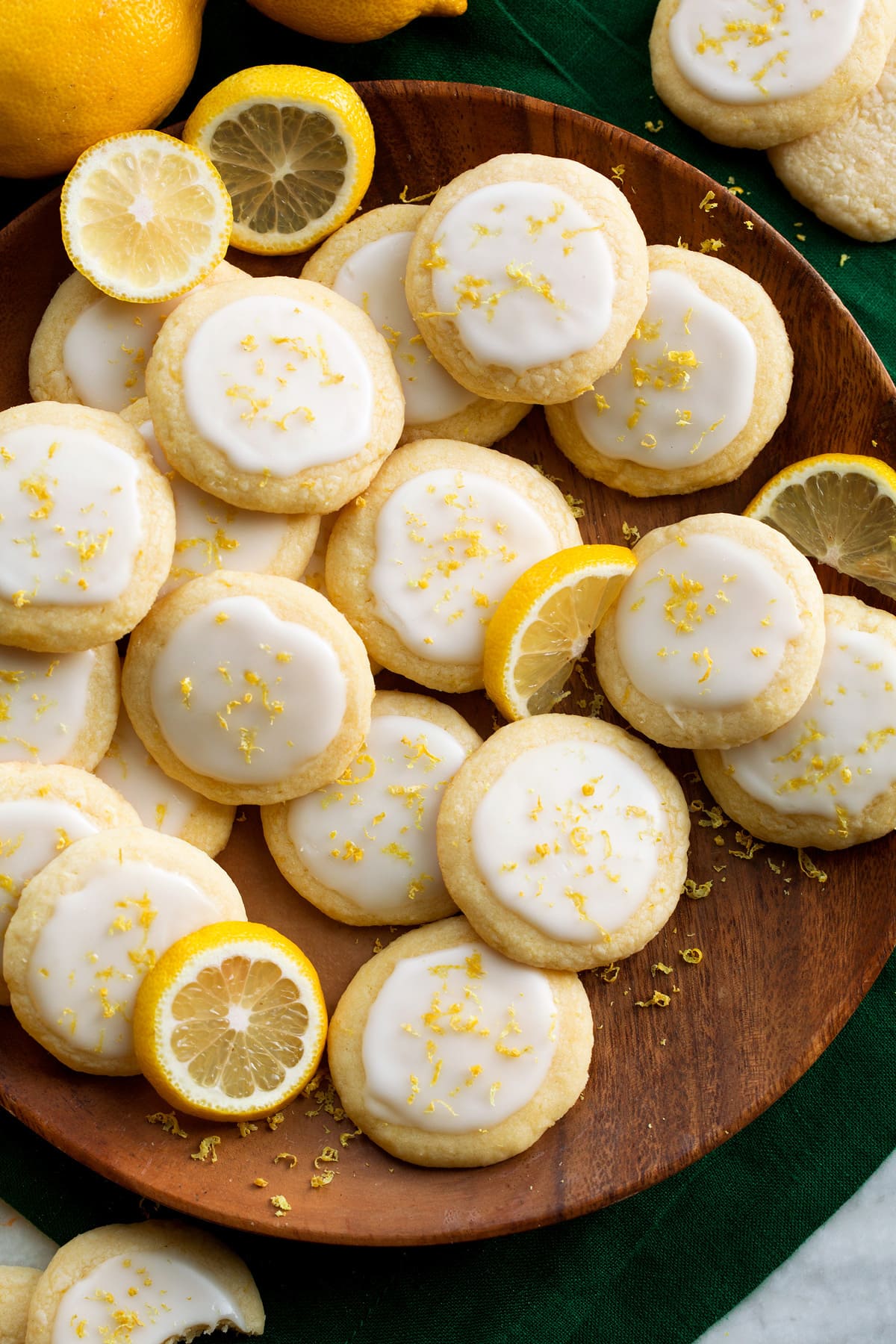 Overhead photo of lemon meltaway cookies on a wooden serving plate.