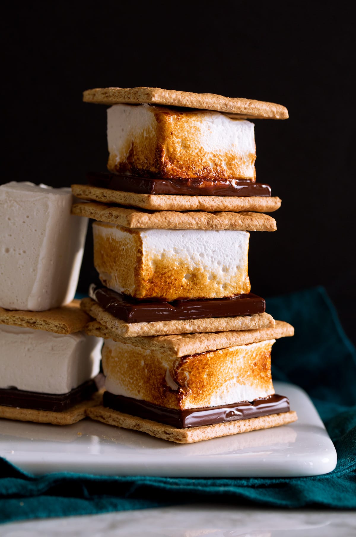 Stack of s'mores with toasted homemade marshmallows.