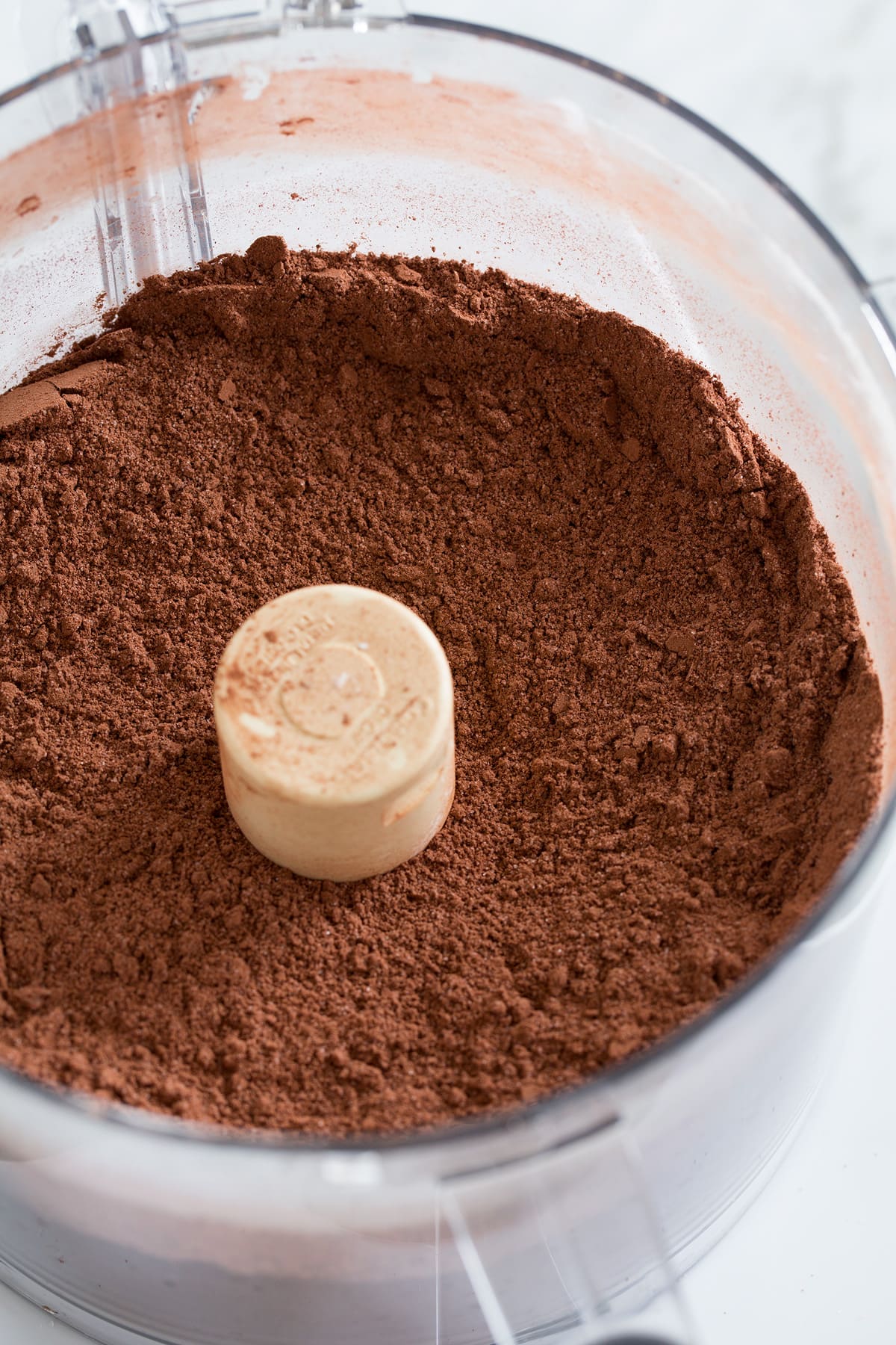 Homemade hot chocolate mix in food processor after blending.