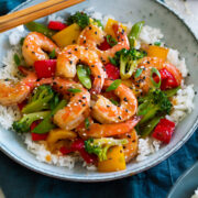 Shrimp stir fry with vegetables and rice.