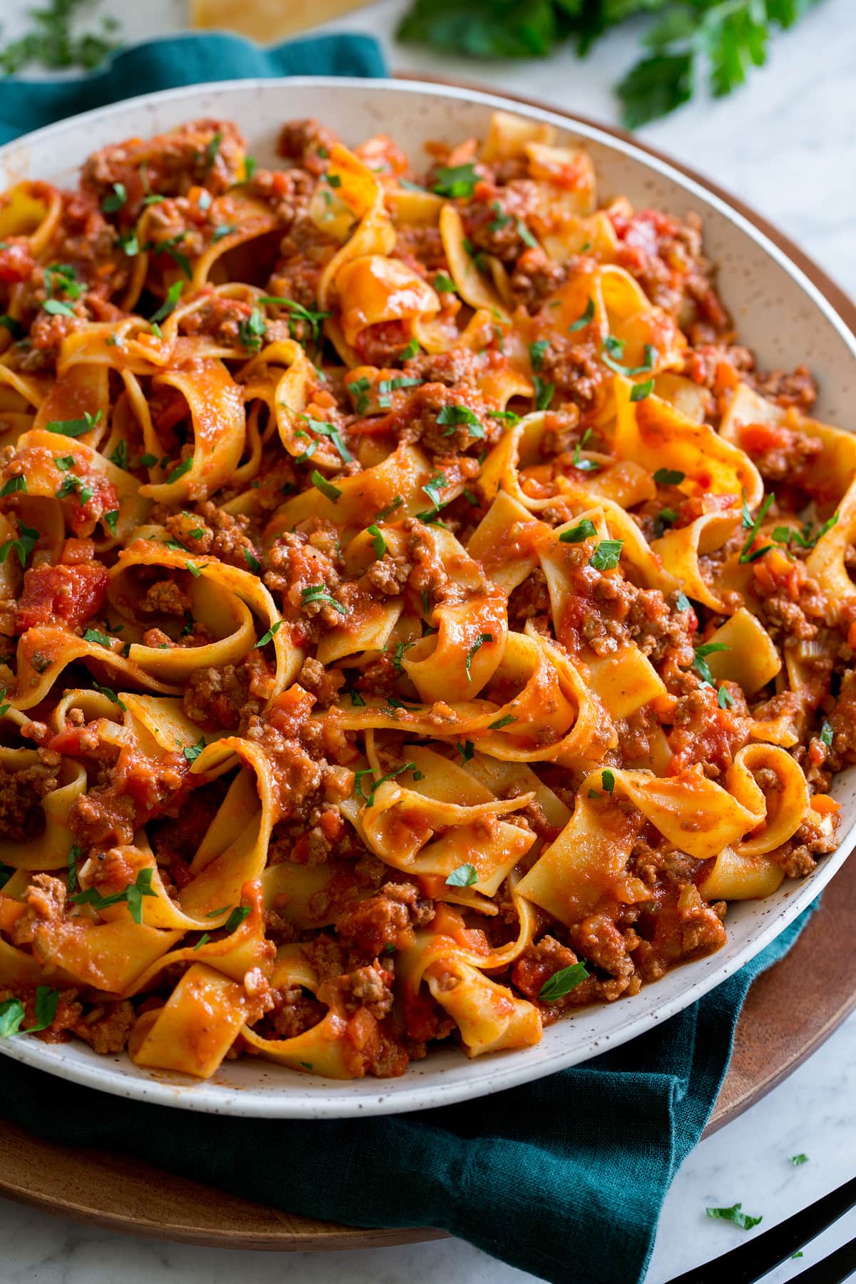 Close up photo of bolognese with pasta.