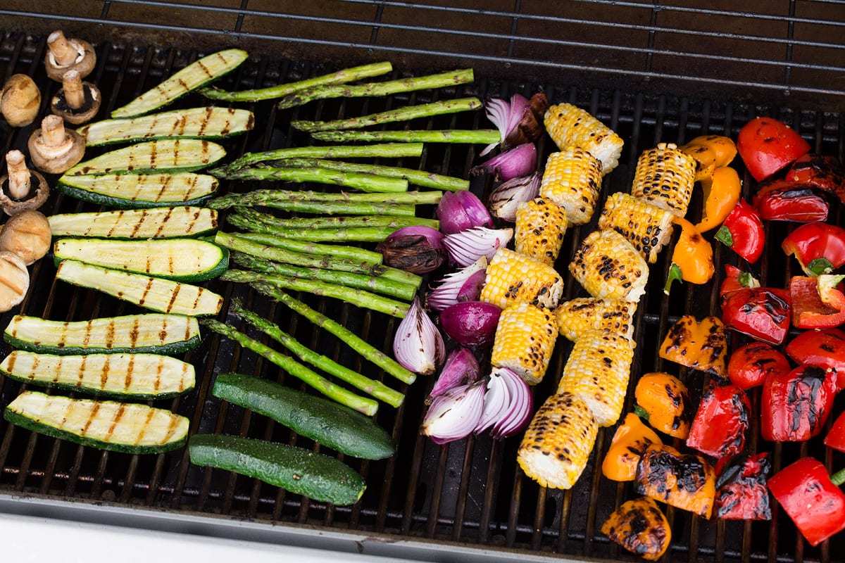 Finished grilled vegetables shown on a gas grill.