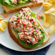 Salmon salad shown on a slice of bread.