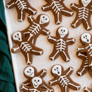Gingerbread cookies with skeleton bodies piped over with white icing.