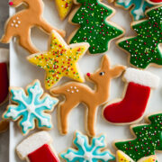 Sugar cookie icing shown over cookies in various colors and shapes.