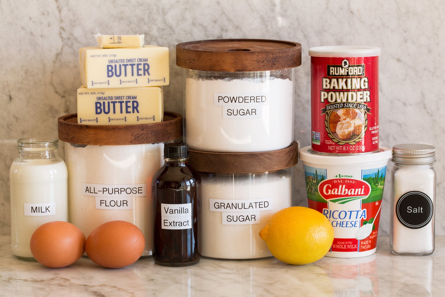 Ingredients needed to make ricotta cookies shown.