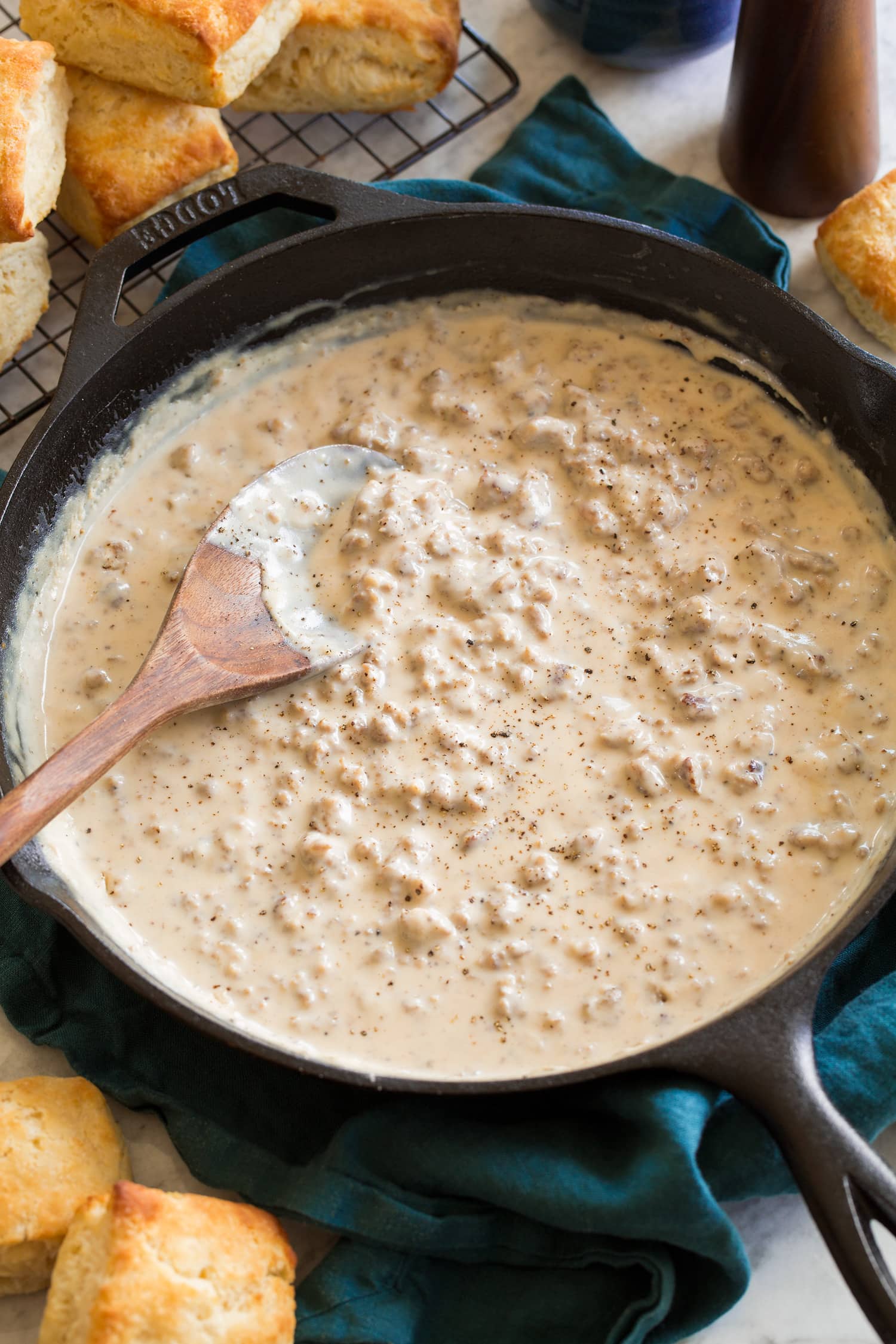 Sausage gravy in a skillet shown from a side angle in a skillet.