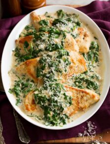 Pan seared chicken breasts with spinach sauce.