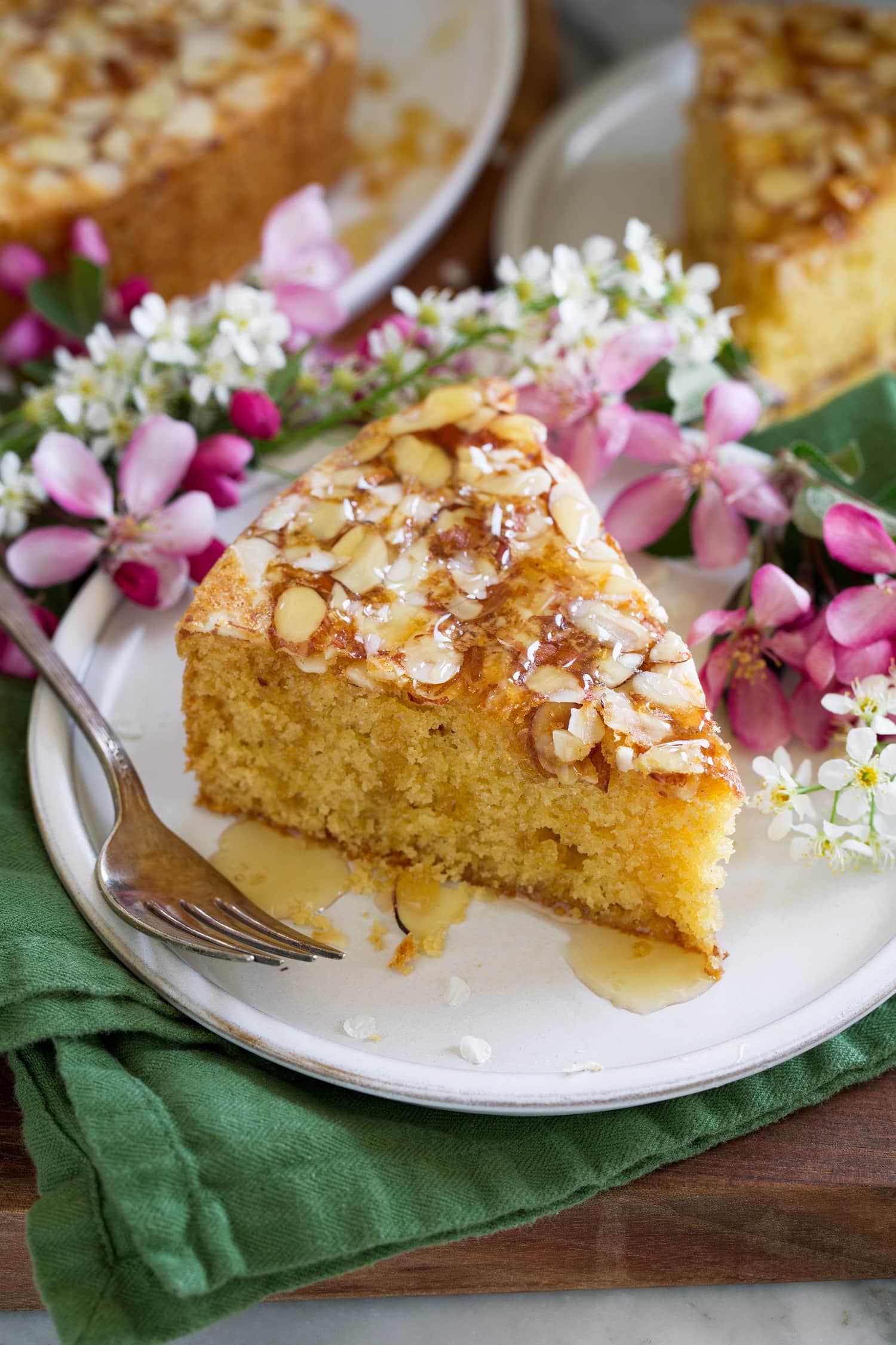 Honey cake with sliced almonds and honey drizzle finish.