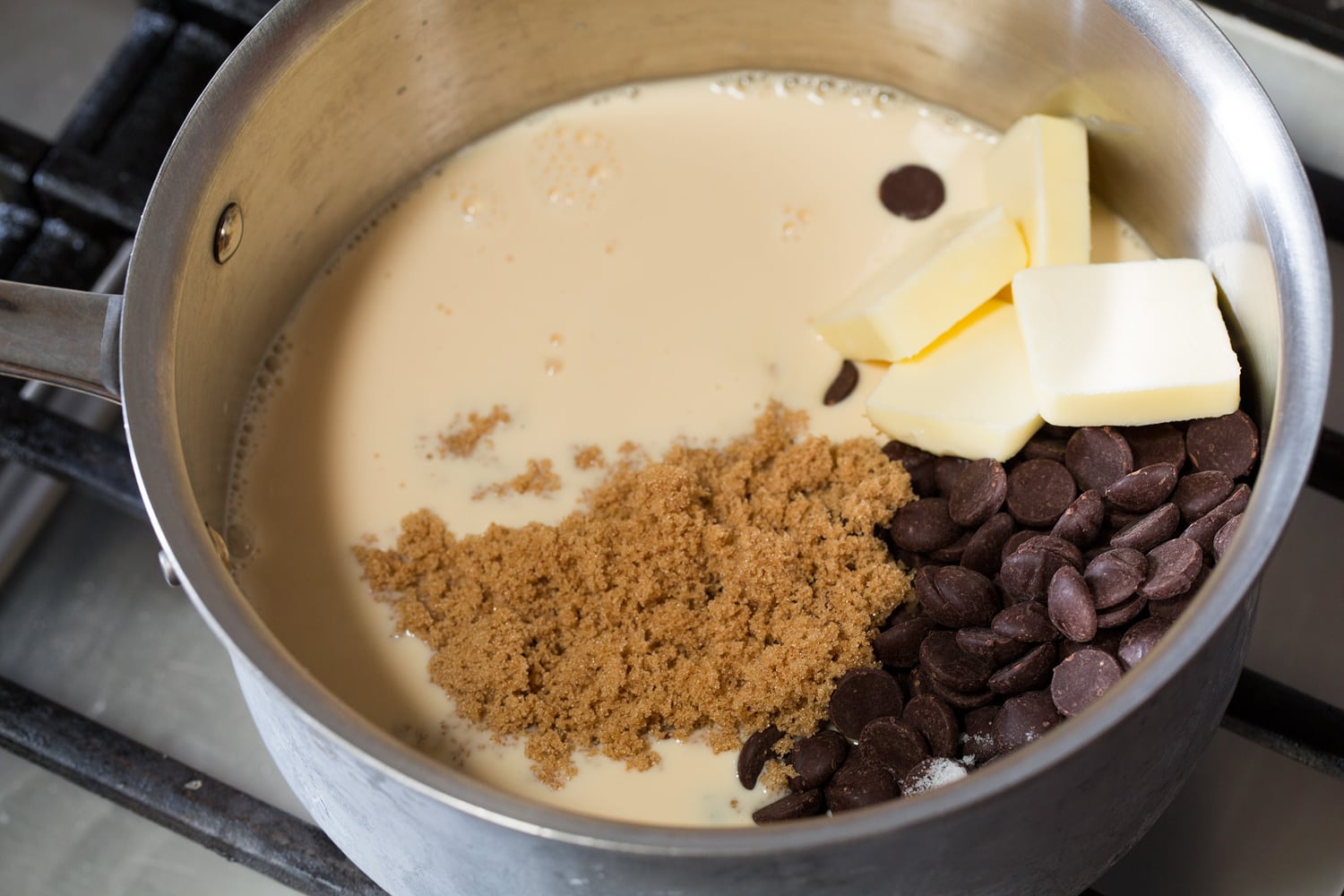 Hot fudge ingredients in saucepan before mixing and cooking.
