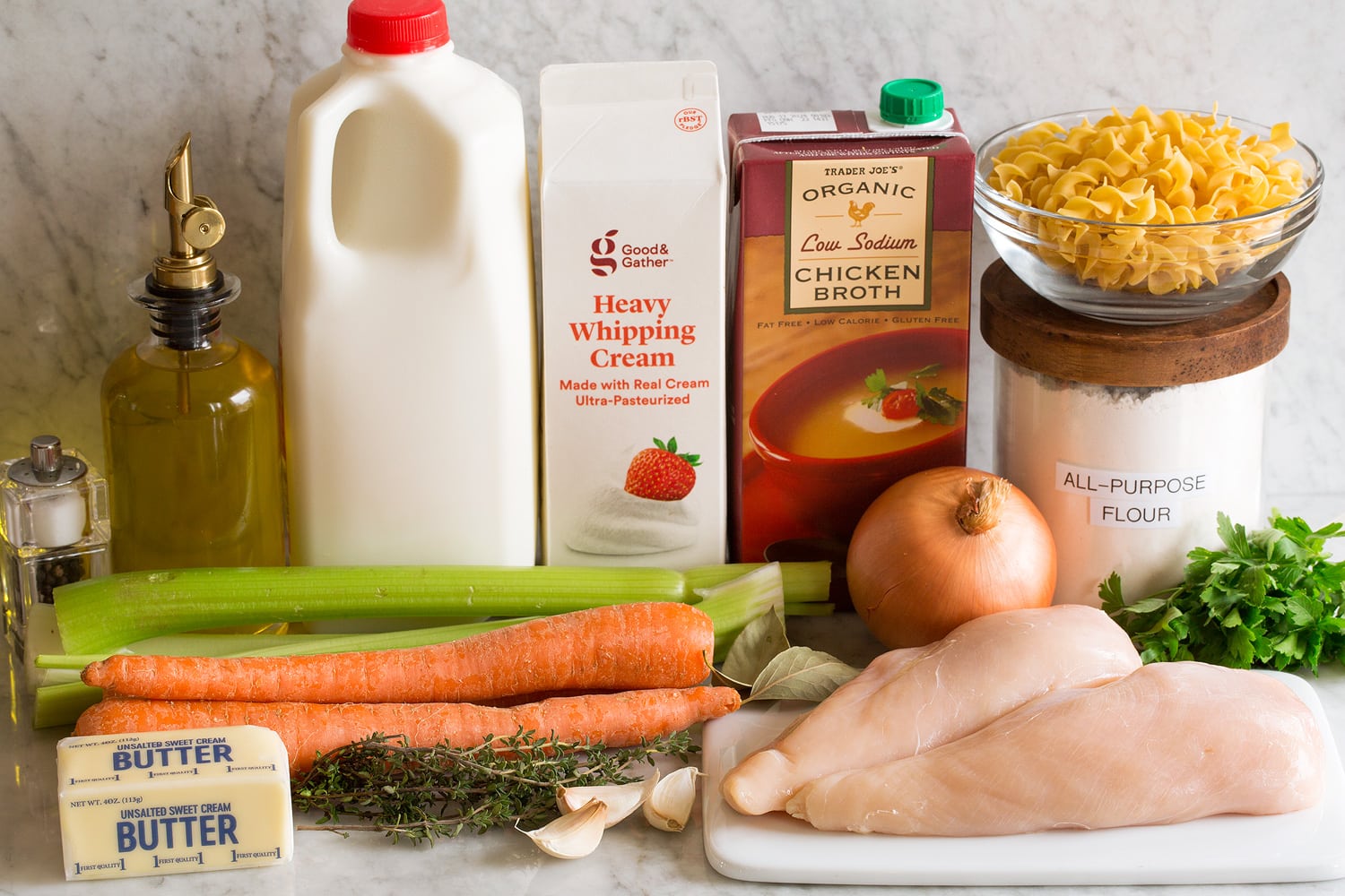 Ingredients needed to make creamy chicken noodle soup.